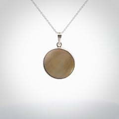 Hand crafted contemporary woolly mammoth tusk and sterling silver drop necklace. This necklace is provided with a sterling silver chain. Contemporary woolly mammoth tusk drop necklace with sterling silver.