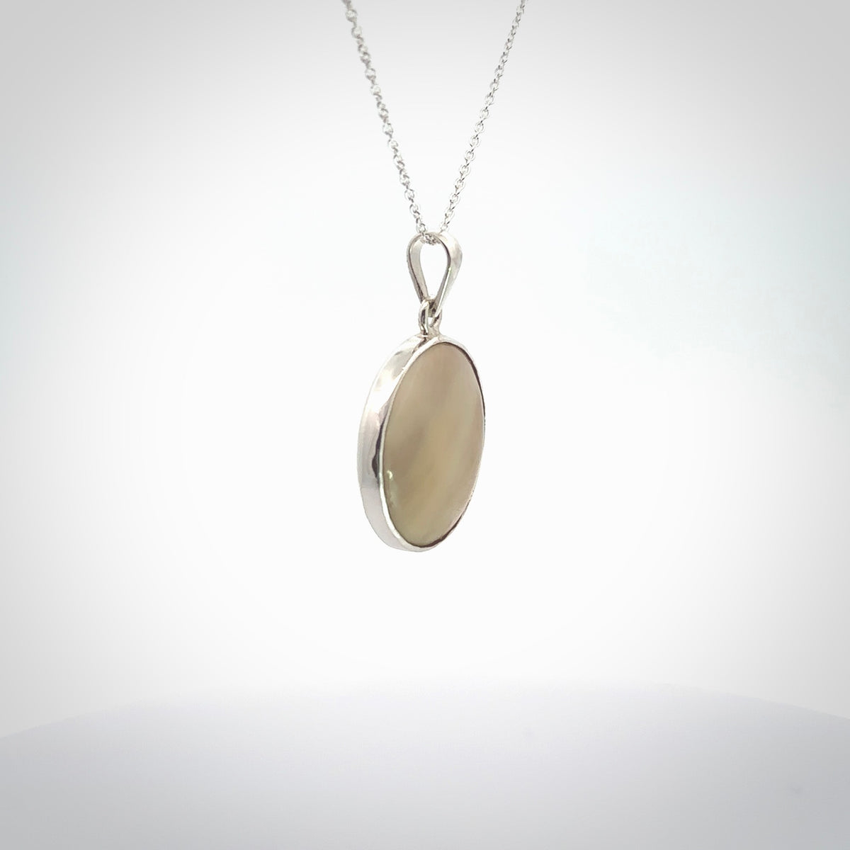 Hand crafted contemporary woolly mammoth tusk and sterling silver drop necklace. This necklace is provided with a sterling silver chain. Contemporary woolly mammoth tusk drop necklace with sterling silver.