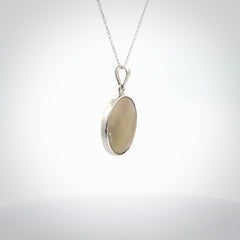 Hand crafted contemporary woolly mammoth tusk and sterling silver drop necklace. This necklace is provided with a sterling silver chain. Contemporary woolly mammoth tusk drop necklace with sterling silver.