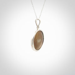 Hand crafted contemporary woolly mammoth tusk and sterling silver drop necklace. This necklace is provided with a sterling silver chain. Contemporary woolly mammoth tusk drop necklace with sterling silver.