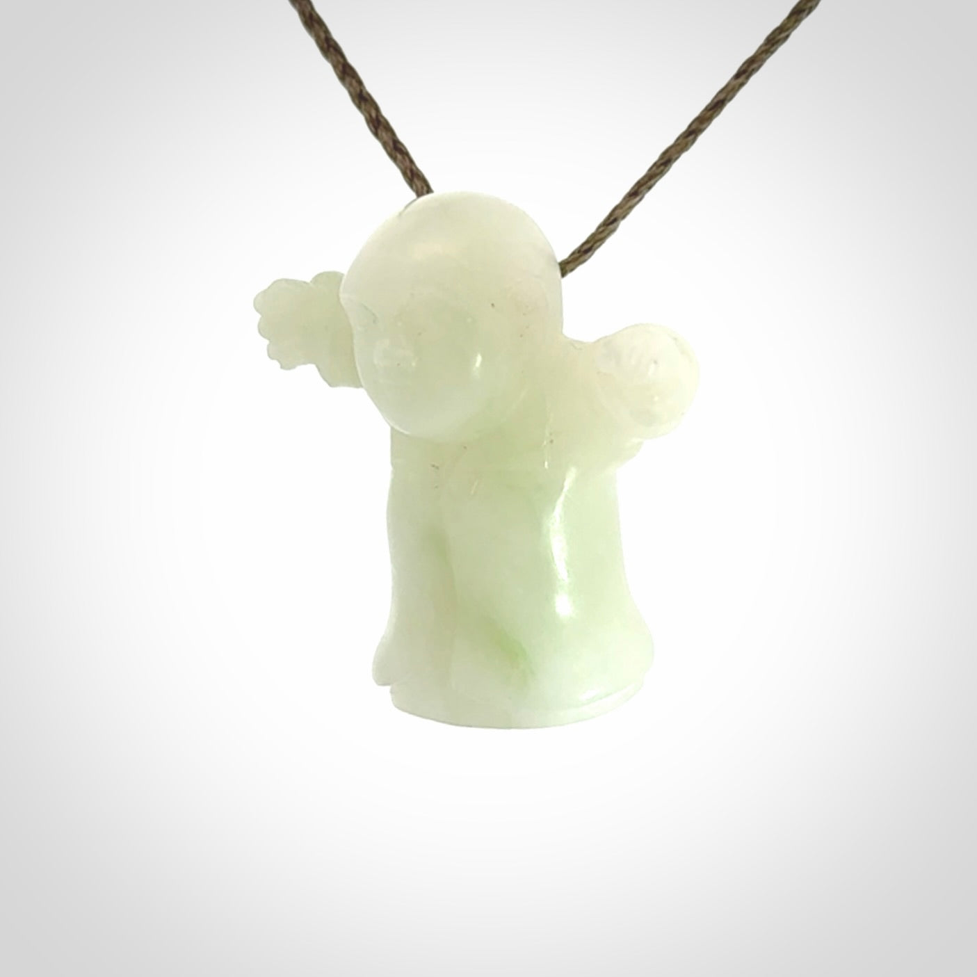 Jadeite monk pendant with adjustable necklace cord. Hand carved by NZ Pacific. Handmade jewellery for sale online. The cord is a hand plaited khaki green colour, which is length adjustable. Peaceful man necklace for men and women. Contemporary necklace hand made from Jadeite.