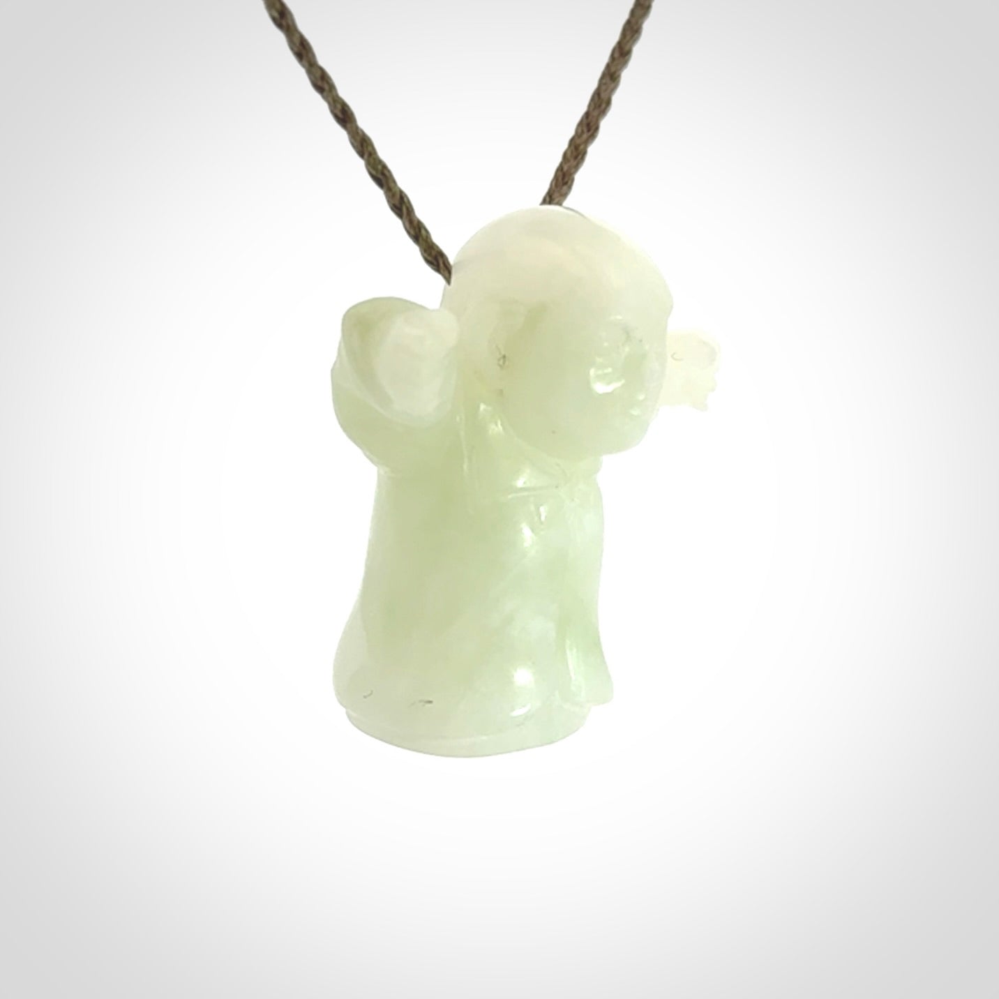 Jadeite monk pendant with adjustable necklace cord. Hand carved by NZ Pacific. Handmade jewellery for sale online. The cord is a hand plaited khaki green colour, which is length adjustable. Peaceful man necklace for men and women. Contemporary necklace hand made from Jadeite.