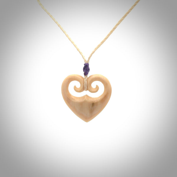 Hand carved heart pendant. Hand made from woolly mammoth tusk. Hand made jewellery for sale online. Rare and unique handmade jewellery. Made by NZ Pacific.