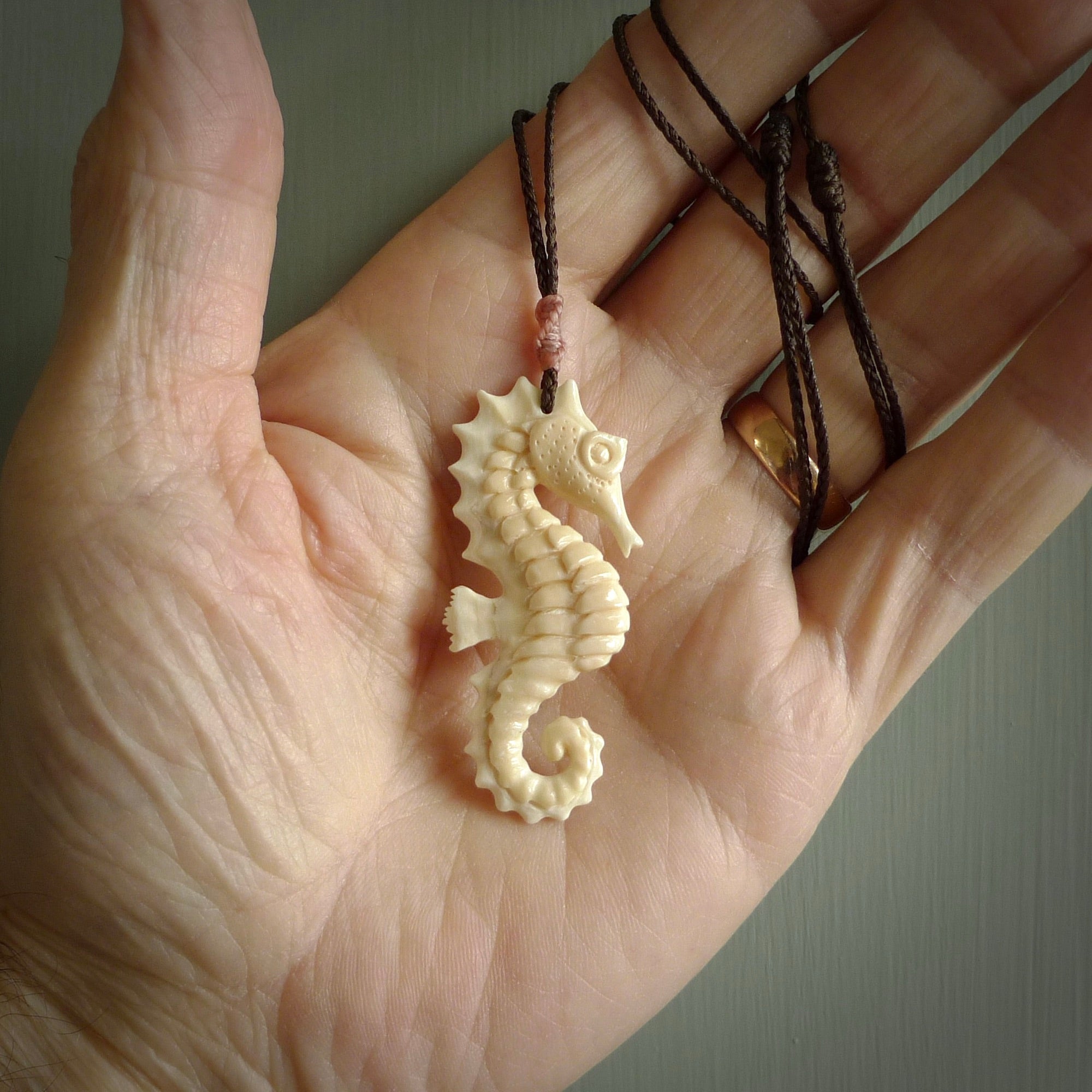 Hand carved woolly mammoth tusk seahorse pendant. Made by NZ Pacific.