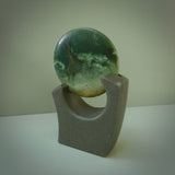 Hand carved New Zealand Marsden Jade Disc with Greywacke stand sculpture. Hand carved here in New Zealand by Ric Moor. This is a 'one only' sculpture, a beautiful display piece.