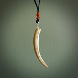 Hand carved incredible Huia bird beak woolly mammoth tusk carving. A stunning work of art, beautifully replicating a hula bird beak. This pendant was hand carved in mammoth tusk by artist Sami. A one off collectors item that has been hand crafted to be worn or displayed.