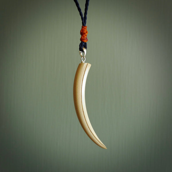 Hand carved incredible Huia bird beak woolly mammoth tusk carving. A stunning work of art, beautifully replicating a hula bird beak. This pendant was hand carved in mammoth tusk by artist Sami. A one off collectors item that has been hand crafted to be worn or displayed.