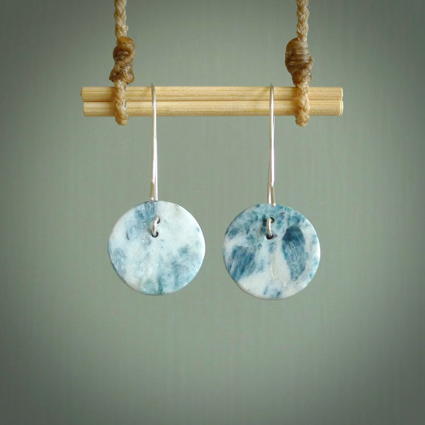 These are a pair of beautiful Aotea Stone and sterling silver earrings. It is carved from Aotea Stone from New Zealand. It is a light blue and white colour with sterling silver. Hand made here in New Zealand by Ana Krakosky.