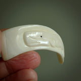 Hand carved whale pendant, carved by us. This piece is carved from boars tusk and is a fantastic depiction of these giants of the deep. This particular piece is a whale design and is lovingly carved.