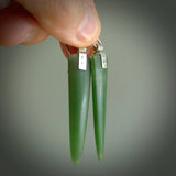 These are stunning large wing shaped drop jade earrings carved in New Zealand by Josey Coyle. It is carved from a deep green piece of New Zealand Jade and with Sterling Silver hooks and findings.