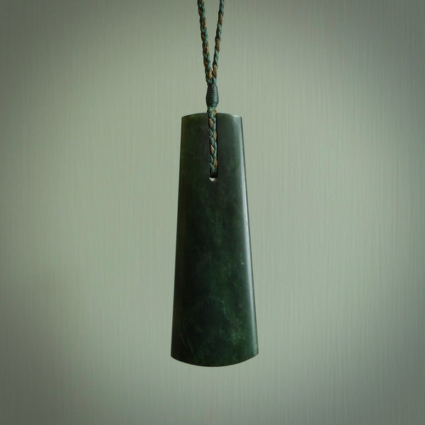Hand made New Zealand jade drop with koru pendant. Hand carved in New Zealand by Kerry Thompson. Hand made jewellery. Unique large Jade drop with fixed length Manuka/Olive coloured cord. Free shipping worldwide.