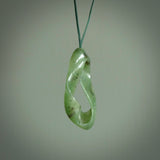 This little piece is a hand carved möbius ribbon pendant. We've carved this from Nephrite Jade from Aceh. It has very subtle colour variations in the stone and is a delightful, small and artistic piece of jewellery.