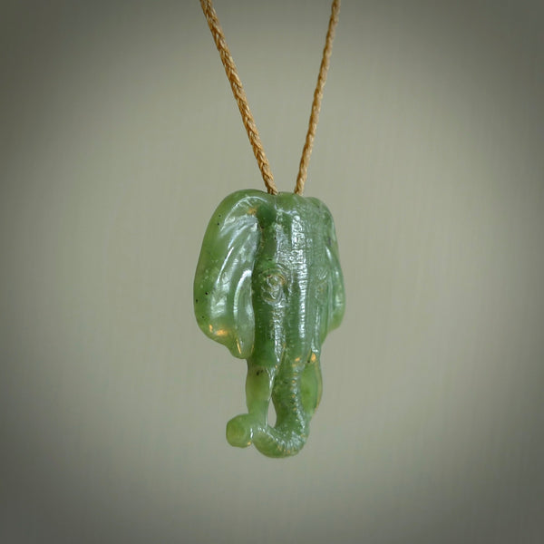 This is a handcarved elephant. Carved in a beautiful darker green piece of New Zealand jade. The cord is hand-plaited and length adjustable in a dark or pale green.