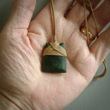 Hand carved from a lovely piece of local New Zealand Jade. The quality of the workmanship and design is outstanding - this is a piece you will want to wear all the time. We have suspended this from a 3-plait tan cord which can be adjusted with a couple of slip knots and tan binding.