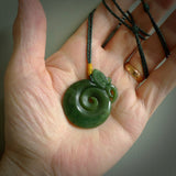 Hand carved medium sized jade manaia with koru pendant. Made for NZ Pacific by Ross Crump. We will ship this to you with an express courier service. This is a one-off piece and is collectable. A gorgeous pendant!