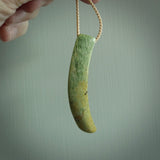 Hand carved pounamu drop pendant. Jade necklace hand made in New Zealand. A contemporary drop pendant carved from rare New Zealand flower jade. NZ Pacific jade jewellery for sale online.