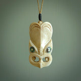 Hand carved incredible Deer Antler  wheku face carving. A stunning work of art. This pendant was hand carved in Deer Antler with Paua Shell inlay for the eyes. Shipping is included in the price. Delivered to you on an adjustable cord.