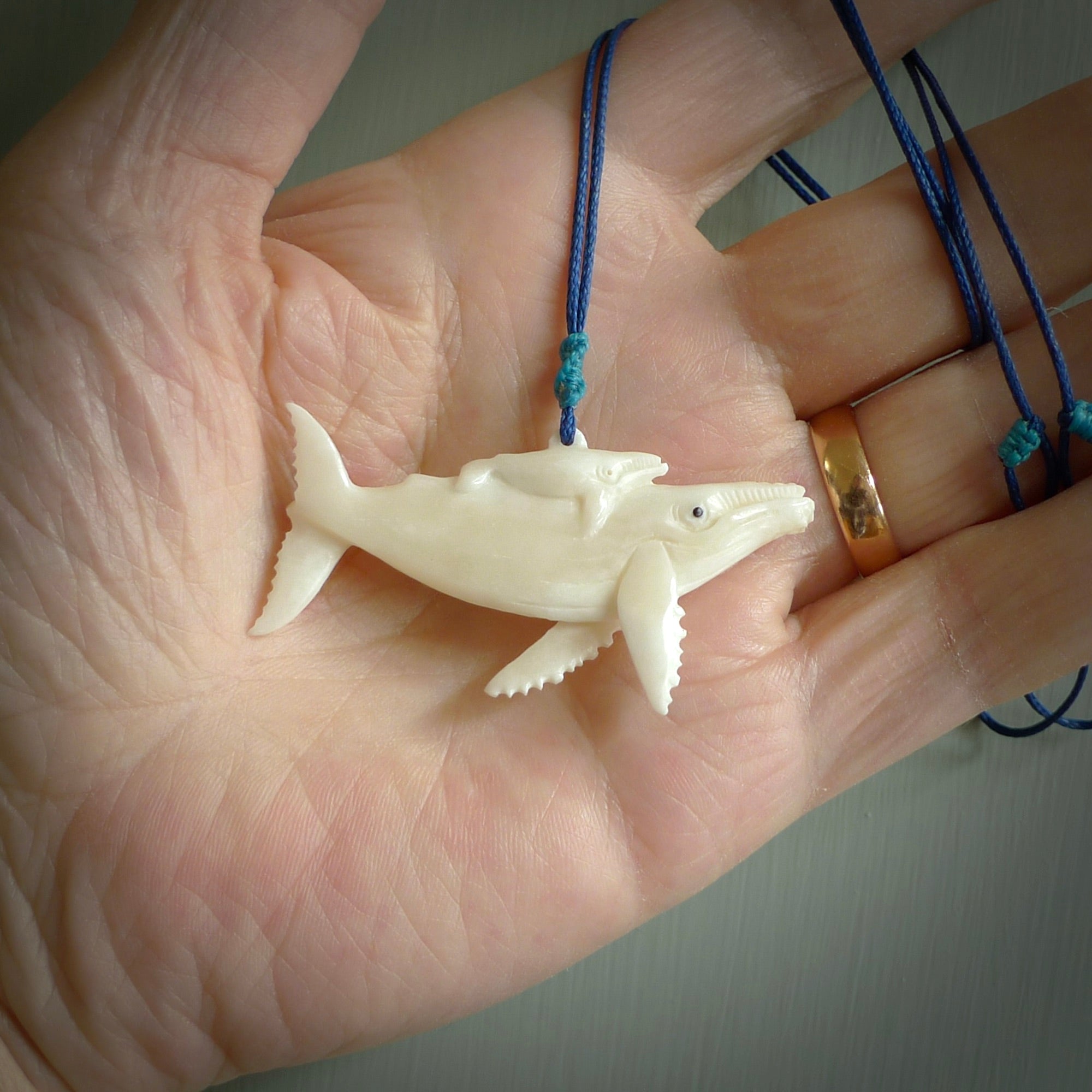 Hand carved bone whale pendant. Carved by NZ Pacific in natural bone. Hand made jewellery for sale online. A beautiful whale-themed pendant - Ocean Moana.