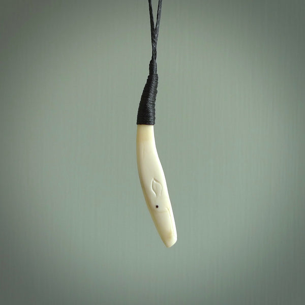 Hand carved sperm whale pendant, carved for us by Fumio Noguchi. This piece is carved from bone and is a fantastic depiction of these giants of the deep. This particular piece is a sperm whale design and is lovingly carved. Free shipping worldwide.