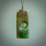 New Zealand jade toki koru pendant. Hand carved in New Zealand. Hand made jewellery.