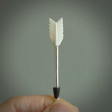 Hand carved arrow made from bone and sterling silver - this is a pendant provided with a sterling silver chain. NZ Pacific pendant for sale online. Hand made archers arrow necklace with sterling silver. One only art to wear.