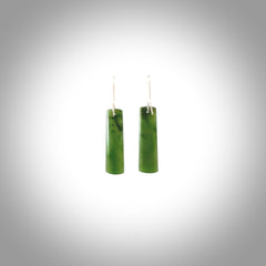 These are stunning medium-large drop shaped jade earrings carved in New Zealand by Darren Hill. It is carved from a semi-translucent light green piece of New Zealand Jade and with Sterling Silver hooks.