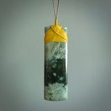 A large and beautiful hand carved toki pendant. This piece is carved from New Zealand flower jade by NZ Pacific. This is a wonderful large toki bound with a tan cord and a traditional lashing. A beautiful, traditional toki for sale online.