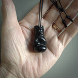 Hand carved boxing glove made from black jade. The cord is adjustable so that you can wear this where it suits you best. We ship these worldwide and the postage is included in the price. 