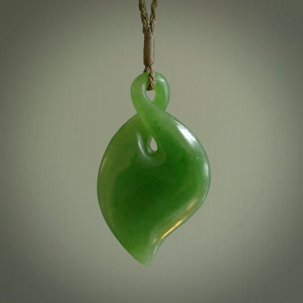 Hand carved New Zealand jade, single twist pendant. Maori pikorua pendant hand carved in New Zealand. Made by NZ Pacific, jade jewellery for sale online. One only hand made by Ross Crump.