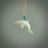 This is a gorgeous little dolphin pendant carved in jadeite. The cord is fine, hand-plaited and length adjustable so you can position the little jade dolphin where it suits you best. Shipping is free worldwide.
