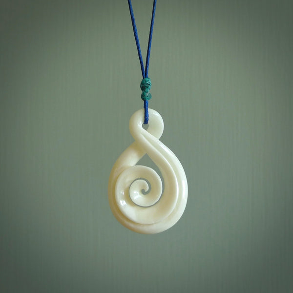 Hand carved bone twist with koru pendant. Real natural bone. These are suspended on a length adjustable plaited cord.