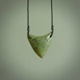 This is a lovely New Zealand Jade, pounamu drop pendant. Hand carved for us by Ric Moor. It is bound with an adjustable black coloured cord which is length adjustable. Free worldwide shipping.