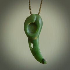 Hand carved huia bird skull made from New Zealand Marsden Jade pendant. Carved for NZ Pacific by Kyohei Noguchi. This is a contemporary piece of jewellery that is carved with intricate detail and clearly shows a beautiful bird skull. We ship this free worldwide with Express Courier.