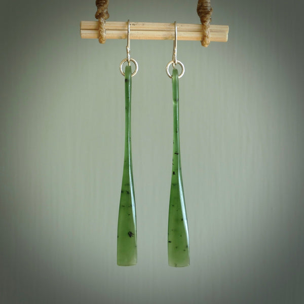 This picture shows hand carved New Zealand Jade, Pounamu paddle shaped, drop earrings. Delivery is free worldwide. NZ made Jade earrings. One pair only hand carved by New Zealand artist, Nicola Rees.