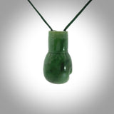 Hand carved boxing glove made from New Zealand Jade. The cord is adjustable so that you can wear this where it suits you best. We have bound these with a Pohutukawa Red cord which contrasts with the green of the jade glove, and reminds of the Everest boxing glove colour. The cost of shipping worldwide is included in the price.