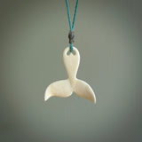 Hand carved bone whale tail pendant. Made by NZ Pacific. Bone whale tail necklace with adjustable cord.
