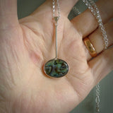 Hand made pendant with one side carved from Woolly mammoth tusk and the other from our local cold water pāua shell. This is a custom design by us and only available fro NZ Pacific.