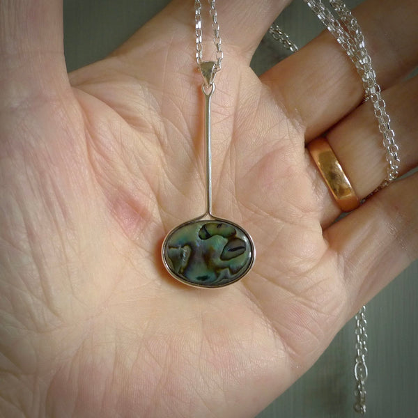 Hand made pendant with one side carved from Woolly mammoth tusk and the other from our local cold water pāua shell. This is a custom design by us and only available fro NZ Pacific.