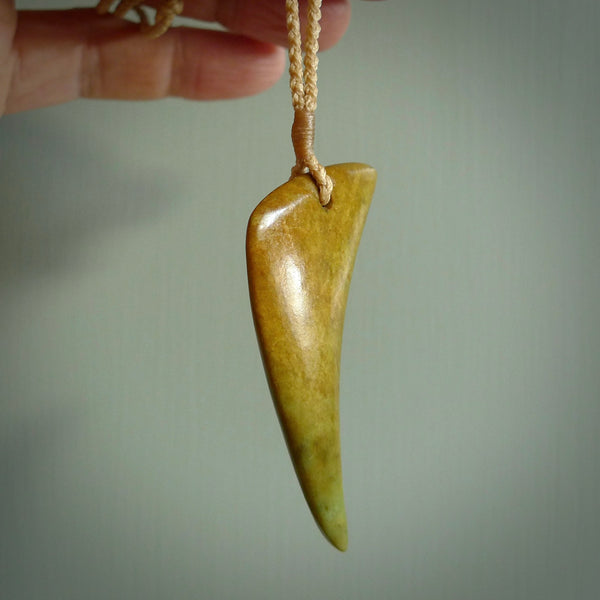 Hand carved pounamu drop pendant. Jade necklace hand made in New Zealand. A contemporary drop pendant carved from rare New Zealand jade. NZ Pacific jade jewellery for sale online.