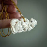 Hand carved tiki. Tiki Pendant made from deer antler by NZ Pacific. Ethnic handcarved jewellery for sale online.