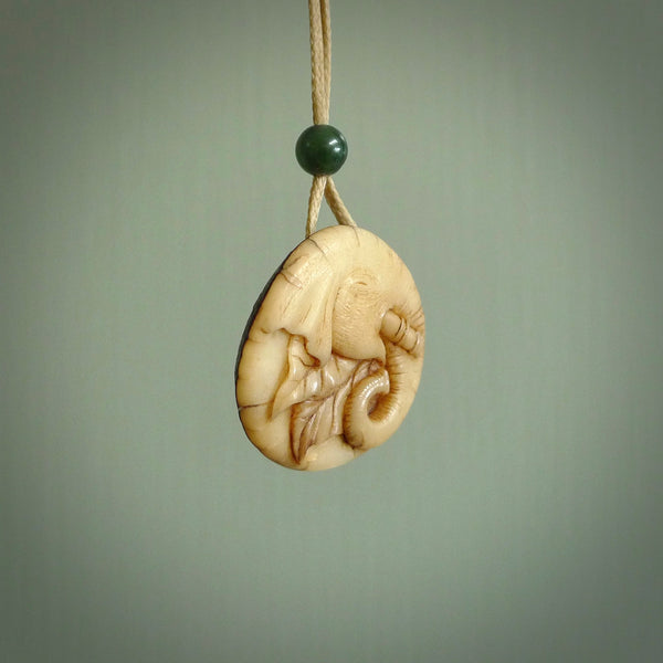 This is a hand carved elephant pendant. It is made from Tigara nut. This is a small sized necklace and is a very unique, one only, pendant that is a collectors piece. Hand carved by New Zealand artist, Sami.