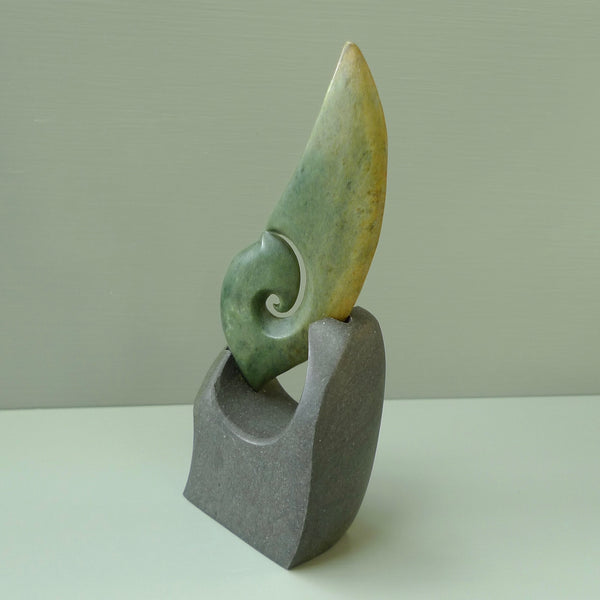 Hand carved New Zealand Flower Jade koru with Greywacke stand sculpture. Hand carved in New Zealand by Ric Moor. This is a one only sculpture and is a beautiful, large, display piece.