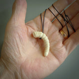 Hand carved huhu bug  pendant, carved for us by Fumio Noguchi. This piece is carved from bone and is a fantastic depiction of these bugs. This particular piece is a huhuh bug design and is lovingly carved. Free shipping worldwide.