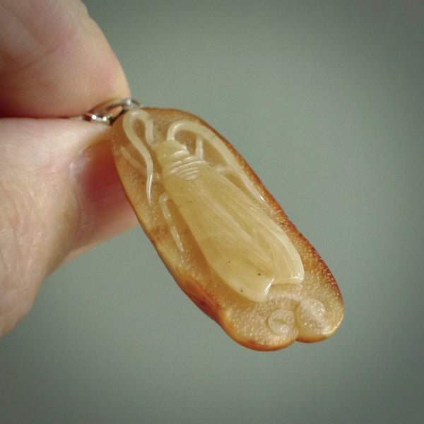 This pendant is handcrafted from rare Kauri Gum Amber. It is supplied with an sterling silver chain. It is a graceful and very interesting piece that will attract admiration and comment. Hand carved here in New Zealand.