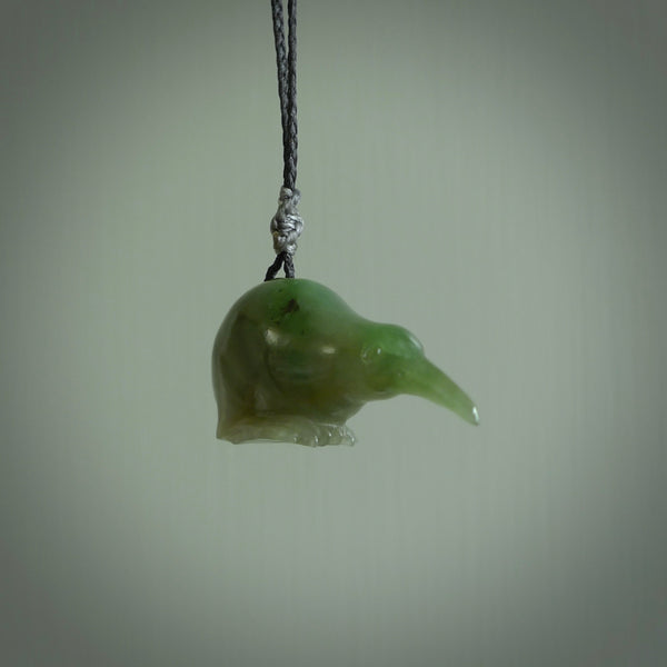 Hand carved Jade kiwi pendant for lovers of birds. Hand made kiwi necklace with black adjustable cord. Unique gifts and Art to Wear by NZ Pacific.