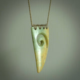 Hand carved New Zealand Flower jade niho, fang, pendant with Koru heart centre. Carved by New Zealand artist Ric Moor. Contemporary New Zealand Jade fang, drop necklace with Koru centre. One only unique pendant for men and women.