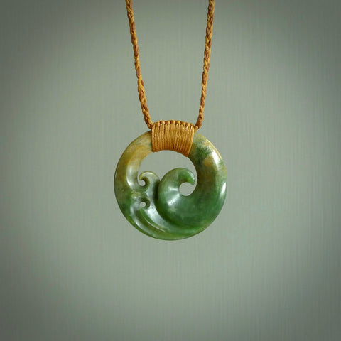 This pendant is a complex koru design. Carved in gorgeous New Zealand jade it is a medium sized pendant that can be worn by anyone. Hand made in New Zealand by NZ Pacific.