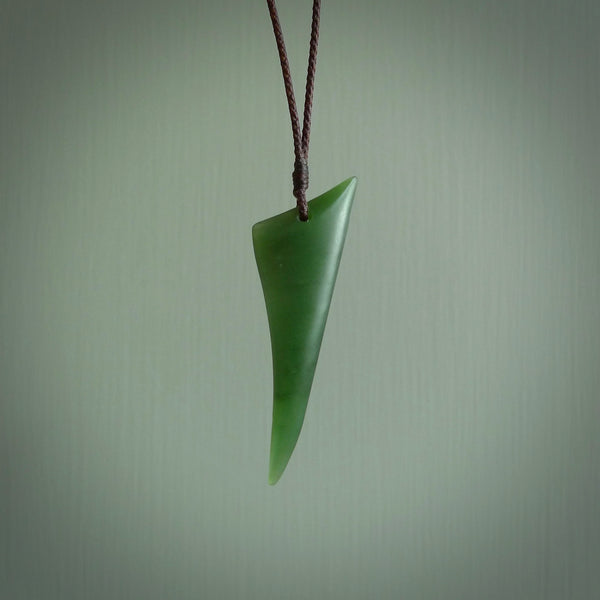Hand carved pounamu drop pendant. Jade necklace hand made in New Zealand. A contemporary drop pendant carved from rare New Zealand jade. NZ Pacific jade jewellery for sale online.