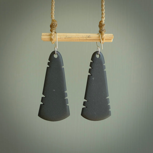 This picture shows Australian Black jade feather earrings with sterling silver hooks. Hand made unique and contemporary feather earrings by Kerry Thompson. Hand carved here in New Zealand from Black Jade. One pair only.