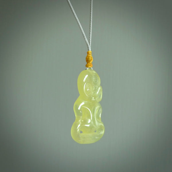 This little Prehnite crystal tiki has been carved to look and feel great. It has a softly carved face and is provided with a hand plaited cord. A gorgeous and small traditional piece that is great for children.